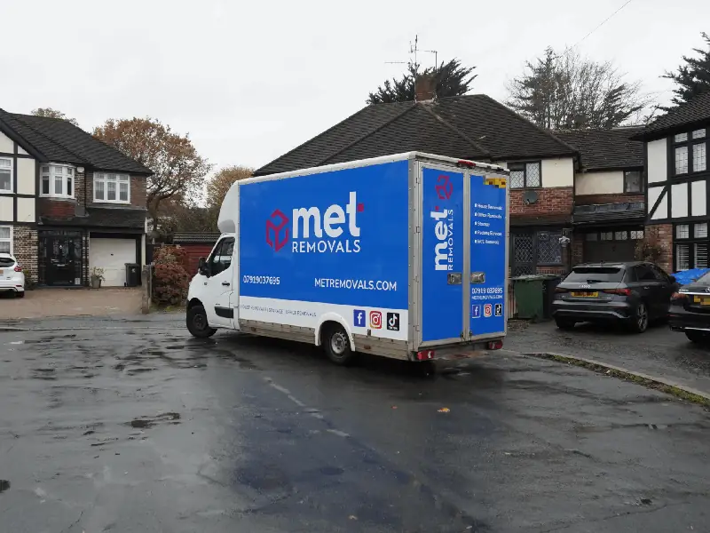 MET Removals van on a residential close with semi-detached homes, removals covering Buckhurst Hill and nearby areas